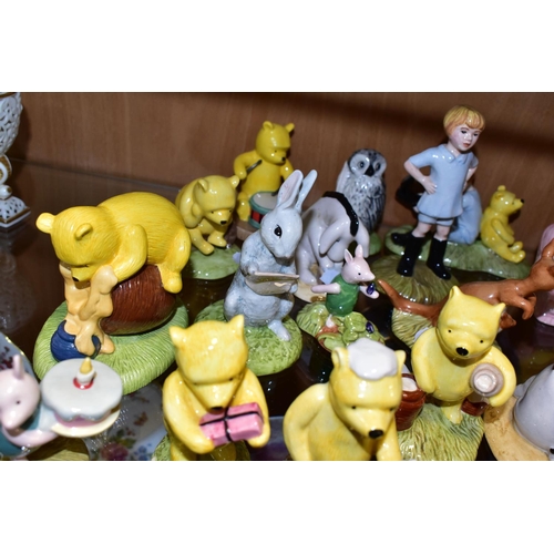 373 - TWENTY ONE ROYAL DOULTON WINNIE THE POOH FIGURES, comprising Winnie the Pooh and the Honeypot WP1, P... 