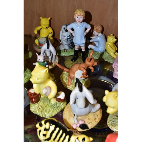 373 - TWENTY ONE ROYAL DOULTON WINNIE THE POOH FIGURES, comprising Winnie the Pooh and the Honeypot WP1, P... 