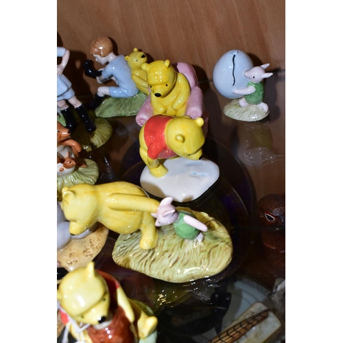 373 - TWENTY ONE ROYAL DOULTON WINNIE THE POOH FIGURES, comprising Winnie the Pooh and the Honeypot WP1, P... 