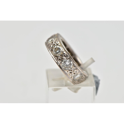 4 - A WHITE METAL DIAMOND FULL ETERNITY RING, comprising a series of brilliant cut diamonds with texture... 