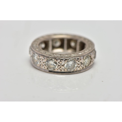 4 - A WHITE METAL DIAMOND FULL ETERNITY RING, comprising a series of brilliant cut diamonds with texture... 