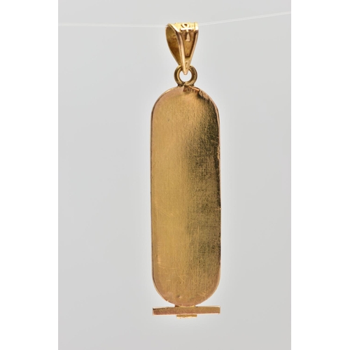 49 - A YELLOW METAL EGYPTIAN CARTOUCHE PENDANT, of an oval outline displaying hieroglyphics, fitted with ... 