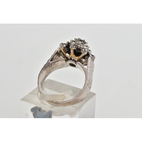 5 - A WHITE METAL DIAMOND FLORAL CLUSTER RING, comprising a brilliant cut central diamond with single cu... 