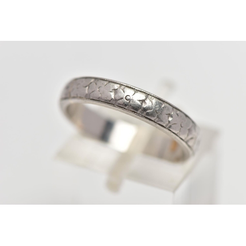 50 - A WHITE METAL BAND RING, decorated with a slightly worn floral pattern, stamped 'HA Platinum', ring ... 