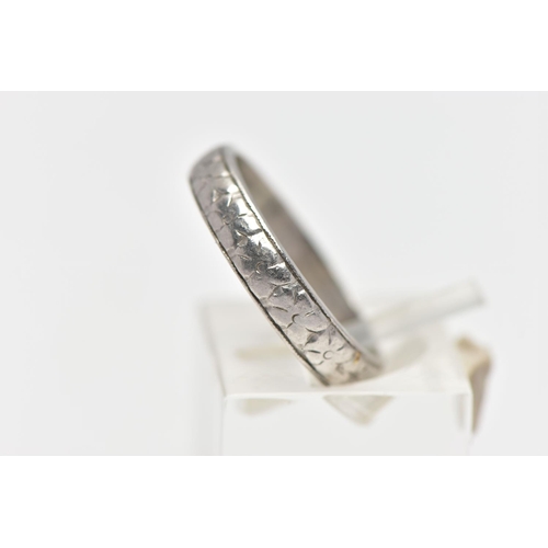 50 - A WHITE METAL BAND RING, decorated with a slightly worn floral pattern, stamped 'HA Platinum', ring ... 