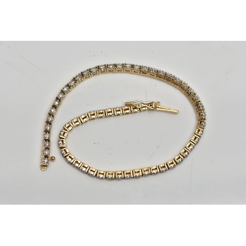 6 - A 9CT YELLOW GOLD DIAMOND LINE BRACELET, designed as a series of approximately sixty two uniform rou... 