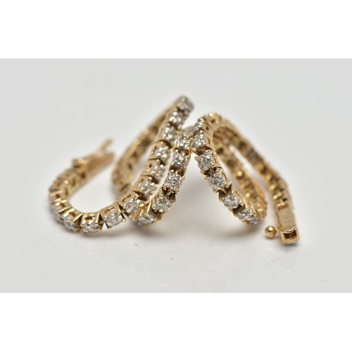 6 - A 9CT YELLOW GOLD DIAMOND LINE BRACELET, designed as a series of approximately sixty two uniform rou... 