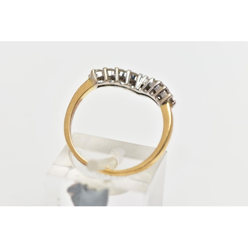 8 - A 9CT GOLD DIAMOND NINE STONE WISH BONE RING, set with a series of nine uniform round brilliant cut ... 