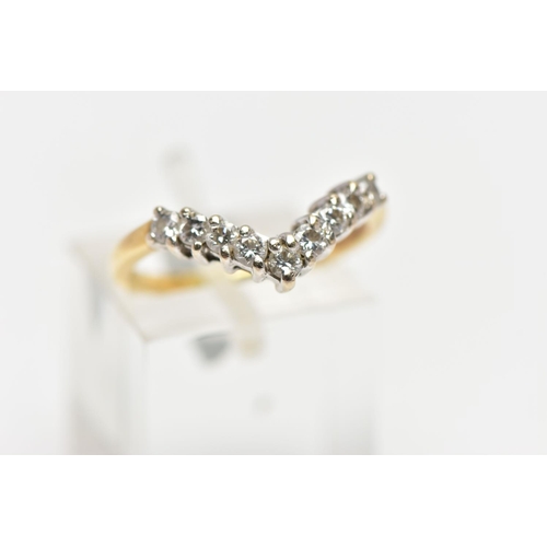 8 - A 9CT GOLD DIAMOND NINE STONE WISH BONE RING, set with a series of nine uniform round brilliant cut ... 