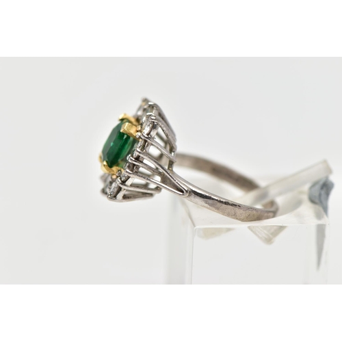 9 - AN 18CT WHITE AND YELLOW GOLD EMERALD AND DIAMOND CLUSTER RING, the rectangular cut emerald, within ... 