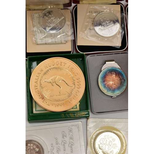 94 - A CARDBOAD BOX CONTAINING SILVER AND SILVER PROOF COINS, to include a 2 OZ .999 silver kookaburra 19... 