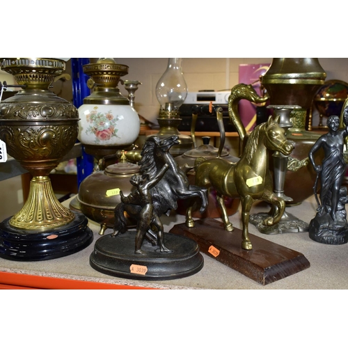 419 - A QUANTITY OF METALWARES, CLOCKS AND CANDELABRA, comprising a brass oil lamp with foliate design bra... 