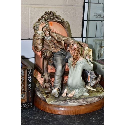 430 - A VERY LARGE CAPO DI MONTE PORCELAIN 'THE  STORY TELLER' ON A WOODEN PLINTH, height 36cm x width 30c... 