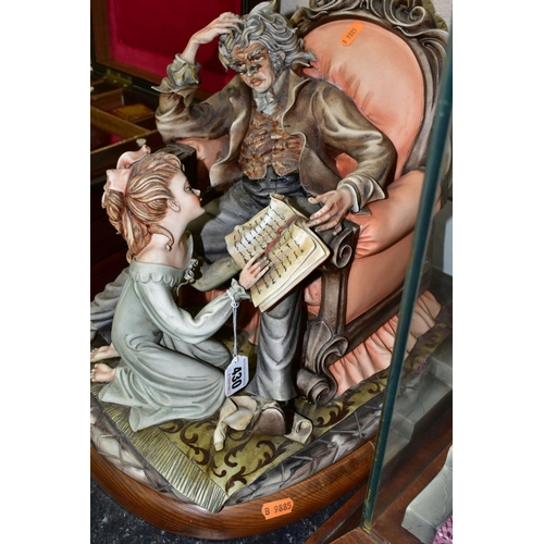 430 - A VERY LARGE CAPO DI MONTE PORCELAIN 'THE  STORY TELLER' ON A WOODEN PLINTH, height 36cm x width 30c... 