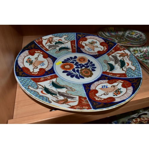 436 - FOUR ORIENTAL PLATES, the Imari style chargers are decorated with fans and nesting egrets, diameter ... 