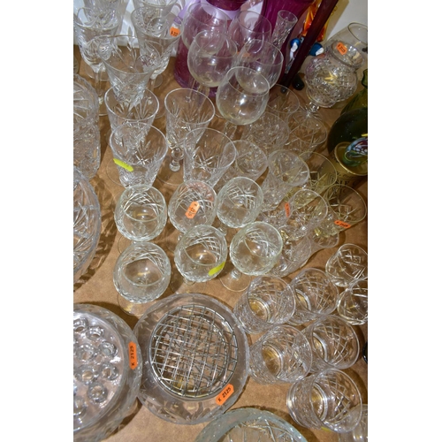 452 - A QUANTITY OF COLOURED GLASS AND CUT CRYSTAL,  comprising a pair of Stuart Crystal brandy glasses, s... 