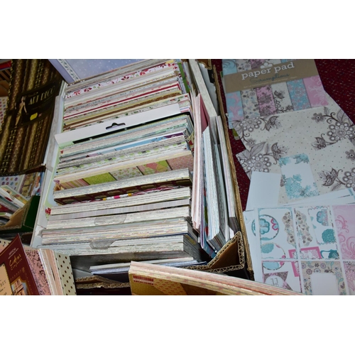 479 - THIRTEEN BOXES OF CRAFT PAPERS, STICKERS AND STENCILS, to include craft papers in 12x12'', 8x8'', 6x... 