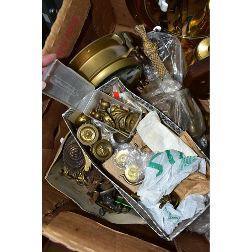 486 - ONE BOX OF ASSORTED BRASSWARE to include  a novelty ship's porthole style mirror, two ship's bells, ... 