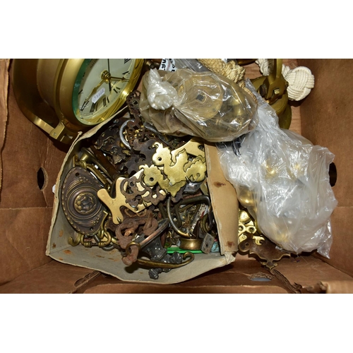 486 - ONE BOX OF ASSORTED BRASSWARE to include  a novelty ship's porthole style mirror, two ship's bells, ... 