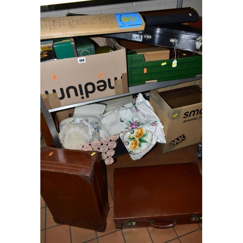 489 - FOUR BOXES OF SUNDRIES AND TABLE LINEN to include a violin in a hard case (broken string, bow hairs ... 