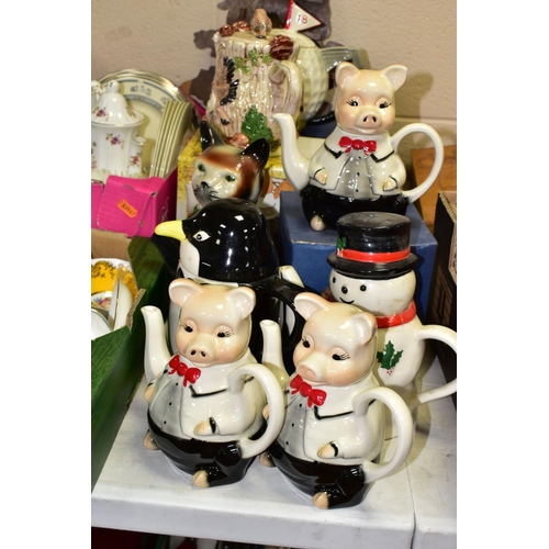 499 - TWO BOXES OF TEAWARES to include eight novelty teapots, a collection of thimbles with a display shel... 