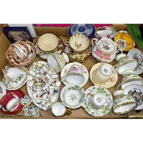 499 - TWO BOXES OF TEAWARES to include eight novelty teapots, a collection of thimbles with a display shel... 