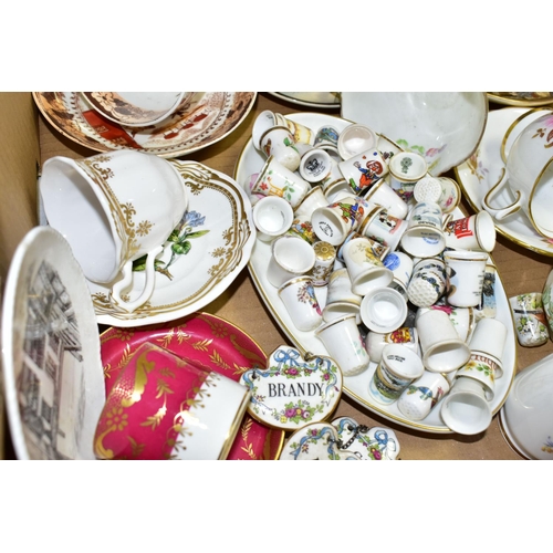 499 - TWO BOXES OF TEAWARES to include eight novelty teapots, a collection of thimbles with a display shel... 