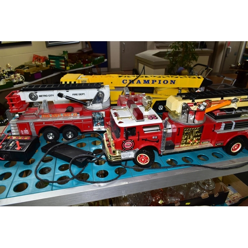 519 - THREE BATTERY OPERATED MODEL VEHICLES, comprising New Bright and Scientific Toys Ltd fire engines, a... 