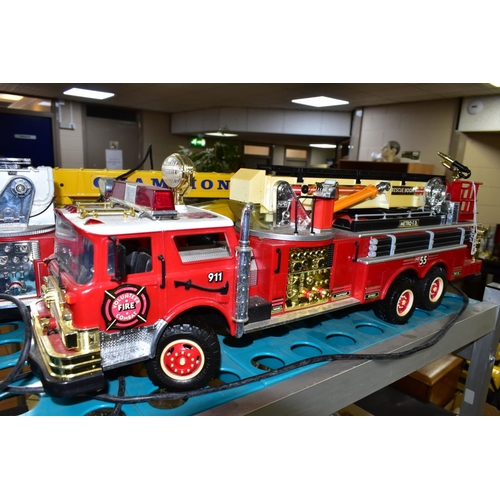 519 - THREE BATTERY OPERATED MODEL VEHICLES, comprising New Bright and Scientific Toys Ltd fire engines, a... 