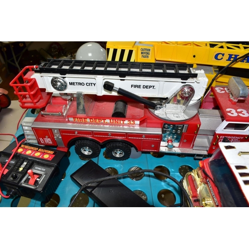 519 - THREE BATTERY OPERATED MODEL VEHICLES, comprising New Bright and Scientific Toys Ltd fire engines, a... 