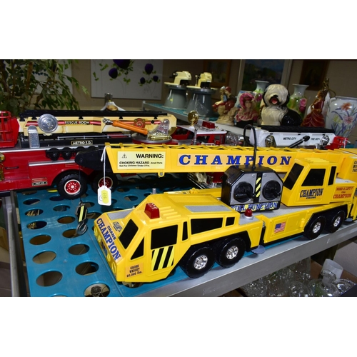 519 - THREE BATTERY OPERATED MODEL VEHICLES, comprising New Bright and Scientific Toys Ltd fire engines, a... 