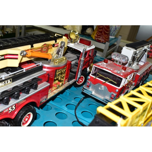 519 - THREE BATTERY OPERATED MODEL VEHICLES, comprising New Bright and Scientific Toys Ltd fire engines, a... 