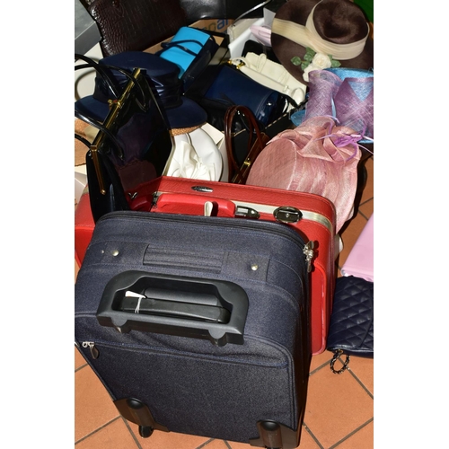 574 - TWO BOXES OF HANDBAGS, HATS & BOXES TOGETHER WITH TWO SUITCASES, to include a small red Antler suitc... 