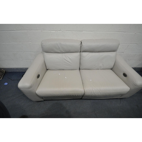 1319 - A CREAM LEATHERETTE UPHOLSTERED RECLINING TWO SEATER SOFA, length 200cm x depth 100cm x height 88cm ... 