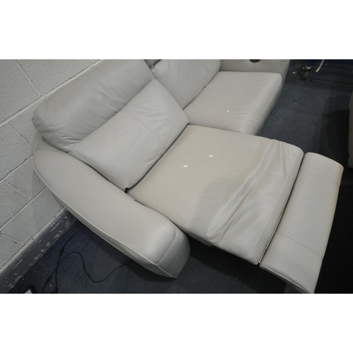 1319 - A CREAM LEATHERETTE UPHOLSTERED RECLINING TWO SEATER SOFA, length 200cm x depth 100cm x height 88cm ... 