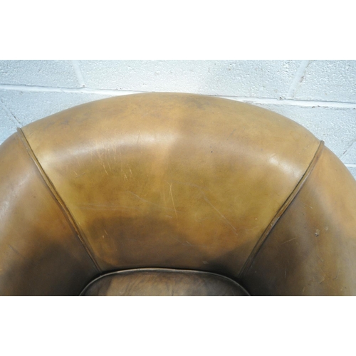 1323 - A TANNED LEATHER TUB CHAIR, on front square tapering legs, with brass casters, width 87cm x depth 82... 