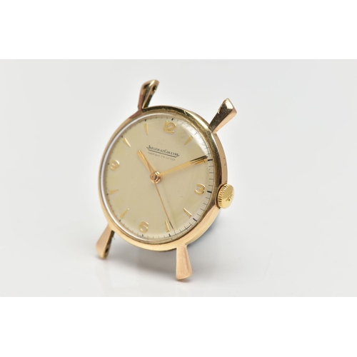 12 - A YELLOW METAL JAEGER-LE COULTRE WATCH HEAD, the champagne colour circular dial, with Arabic quarter... 