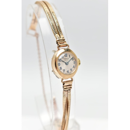 29 - A LADIES 9CT GOLD MARVIN REVUE WRISTWATCH, the circular grey dial, with Arabic numeral markers, dial... 