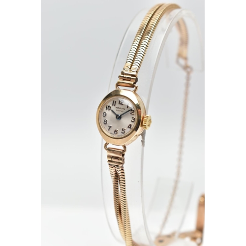 29 - A LADIES 9CT GOLD MARVIN REVUE WRISTWATCH, the circular grey dial, with Arabic numeral markers, dial... 