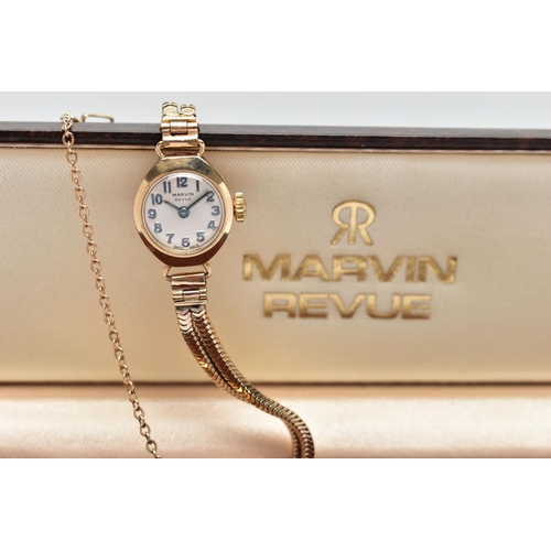 29 - A LADIES 9CT GOLD MARVIN REVUE WRISTWATCH, the circular grey dial, with Arabic numeral markers, dial... 