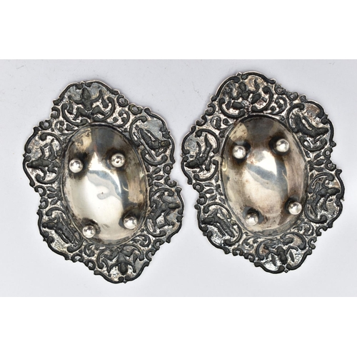 70 - TWO WHITE METAL BON BON DISHES, each dish embossed with Siam characters, to the concave centre and r... 