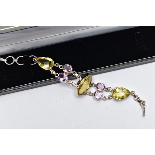 80 - A SILVER GREENISH YELLOW AND AMETHYST BRACELET, the bracelet, comprising variously cut greenish yell... 