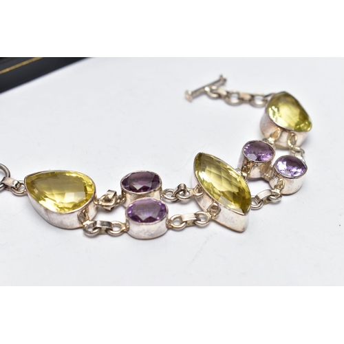 80 - A SILVER GREENISH YELLOW AND AMETHYST BRACELET, the bracelet, comprising variously cut greenish yell... 