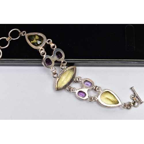 80 - A SILVER GREENISH YELLOW AND AMETHYST BRACELET, the bracelet, comprising variously cut greenish yell... 