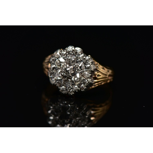 1 - A GEORGIAN DIAMOND CLUSTER RING, set with a principal old mine cut diamond, measuring approximately ... 