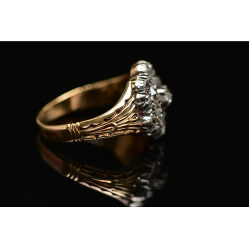 1 - A GEORGIAN DIAMOND CLUSTER RING, set with a principal old mine cut diamond, measuring approximately ... 