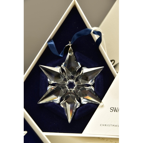 149 - TWO BOXED SWAROVSKI ANNUAL CHRISTMAS ORNAMENTS 2000 AND 2001 (243452 and 267941), both designed by H... 