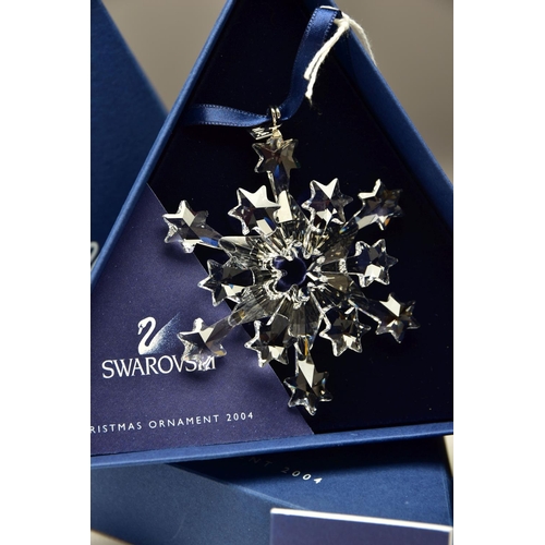 150 - THREE BOXED SWAROVSKI ANNUAL CHRISTMAS ORNAMENTS 2002, 2003 AND 2004 (288802, 622498 and 631562), 20... 