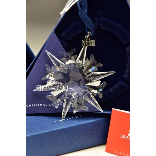 150 - THREE BOXED SWAROVSKI ANNUAL CHRISTMAS ORNAMENTS 2002, 2003 AND 2004 (288802, 622498 and 631562), 20... 