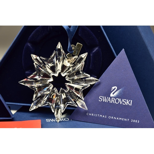 150 - THREE BOXED SWAROVSKI ANNUAL CHRISTMAS ORNAMENTS 2002, 2003 AND 2004 (288802, 622498 and 631562), 20... 